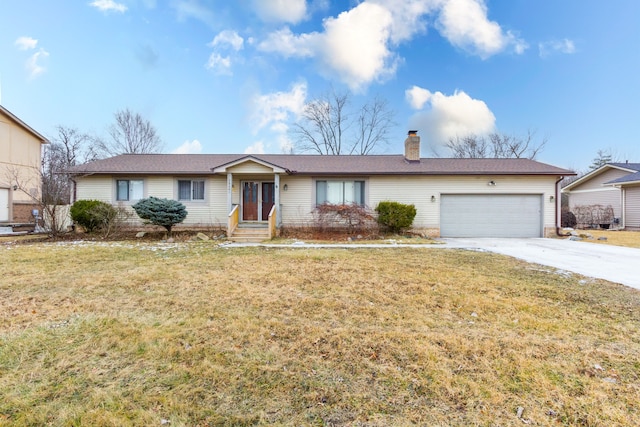 single story home featuring a garage and a front lawn