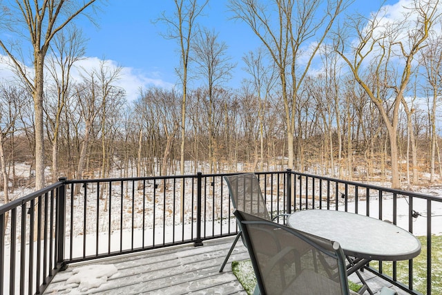 view of snow covered deck