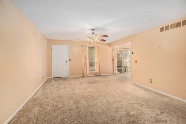 unfurnished room featuring ceiling fan and carpet