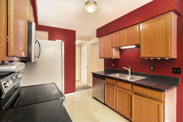 kitchen with sink and appliances with stainless steel finishes