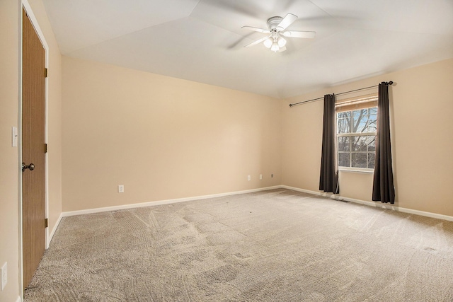 carpeted empty room with lofted ceiling and ceiling fan