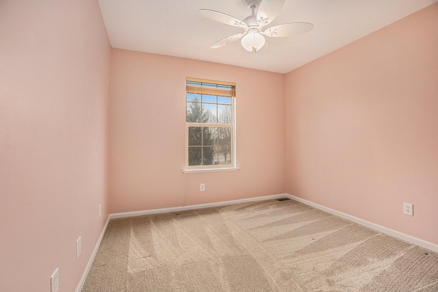 empty room featuring ceiling fan and carpet flooring