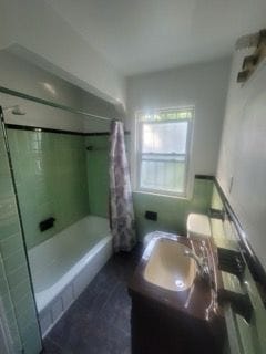 bathroom with vanity and shower / bath combo