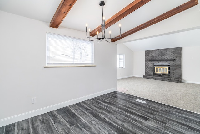 unfurnished living room featuring a fireplace, dark wood-type flooring, and vaulted ceiling with beams