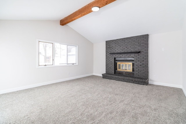 unfurnished living room with carpet, a fireplace, and lofted ceiling with beams