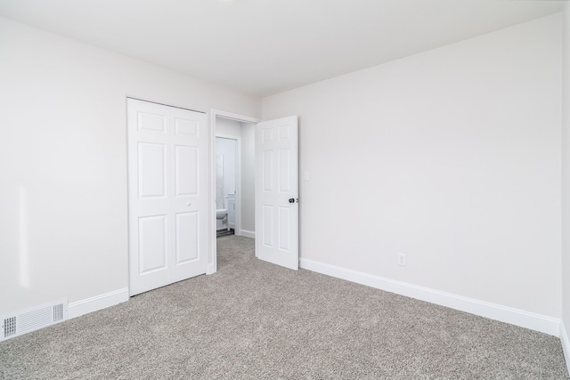 unfurnished bedroom with carpet