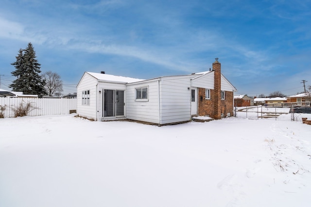 view of snow covered house