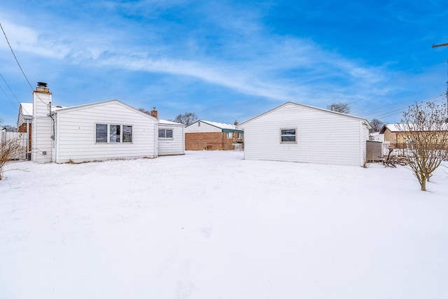 view of snow covered house