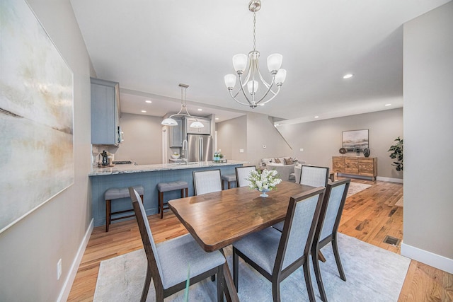 1115 Nature Trl, Manchester, MI 48158 - dining room featuring a notable chandelier and light hardwood / wood-style floors