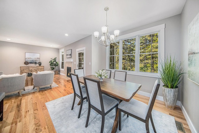 1115 Nature Trl, Manchester, MI 48158 - dining space with a chandelier and light hardwood / wood-style flooring