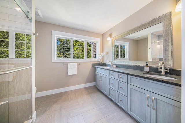 1115 Nature Trl, Manchester, MI 48158 - bathroom featuring a shower with door, vanity, parquet flooring, and toilet