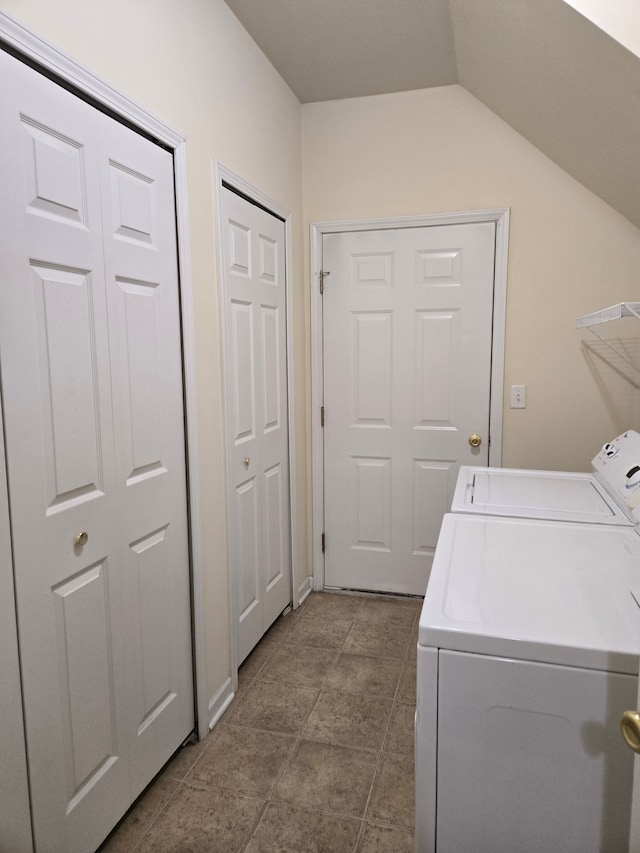 laundry room with light tile patterned flooring and separate washer and dryer