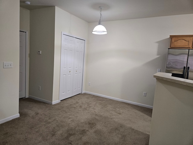 unfurnished room with carpet flooring