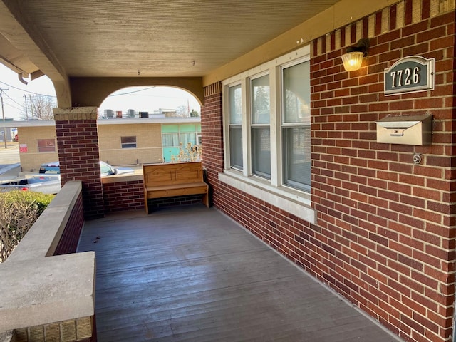 wooden deck featuring covered porch