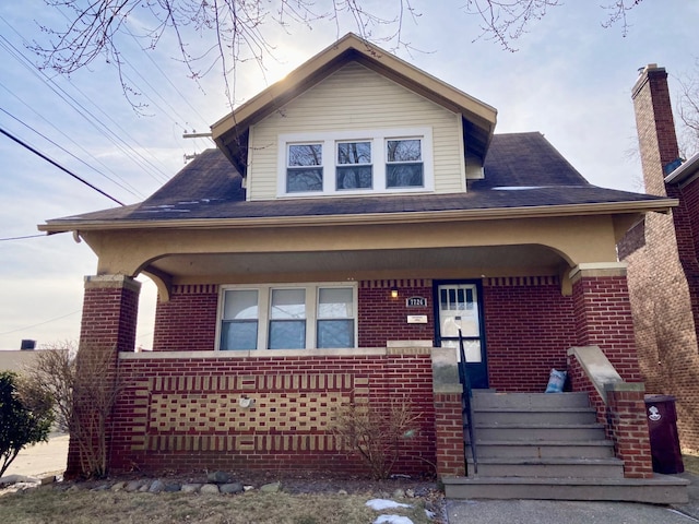 view of front of property featuring covered porch