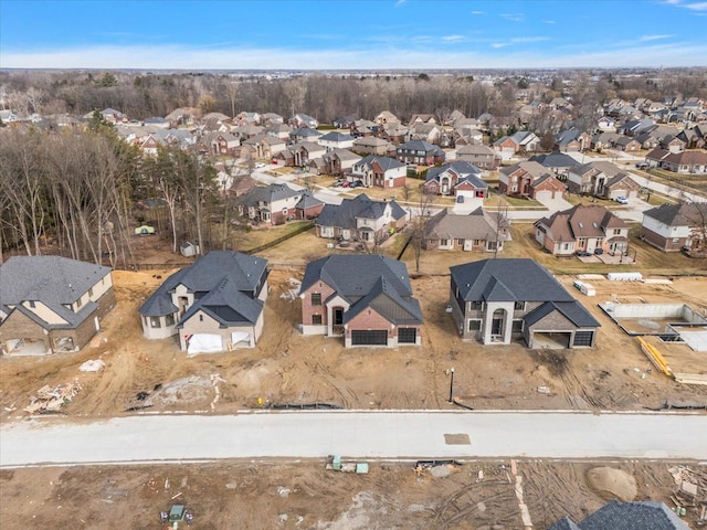 birds eye view of property with a residential view