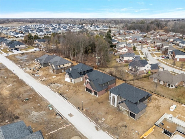 birds eye view of property with a residential view