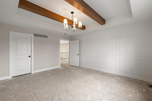 empty room with visible vents, a decorative wall, beamed ceiling, and an inviting chandelier