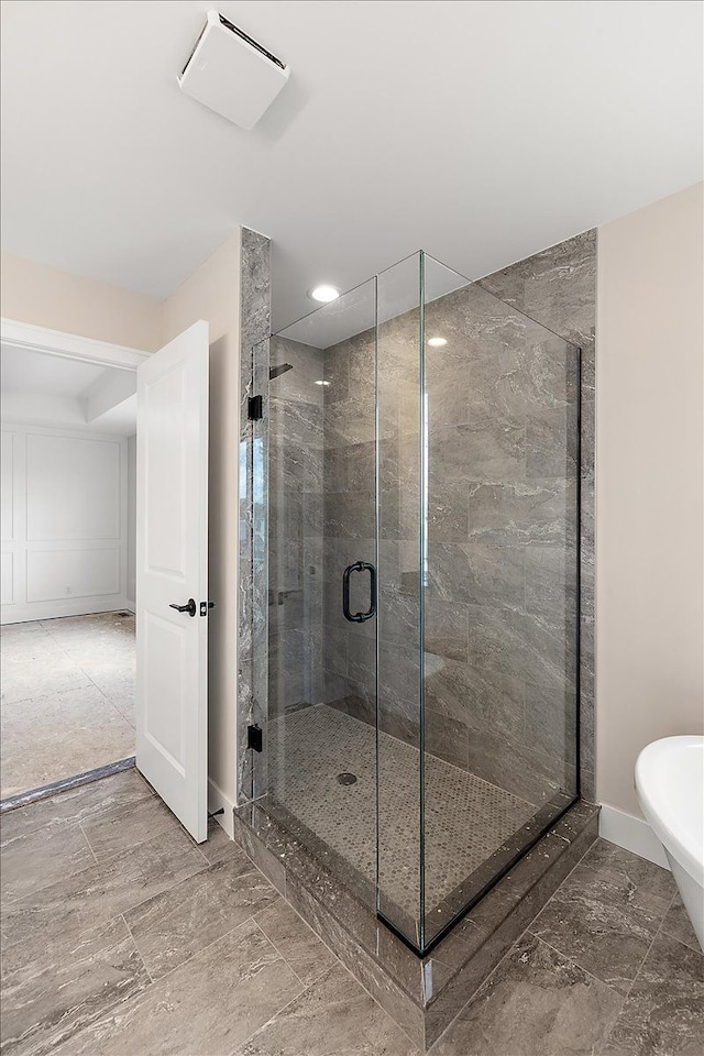 full bathroom featuring a stall shower, marble finish floor, baseboards, and recessed lighting