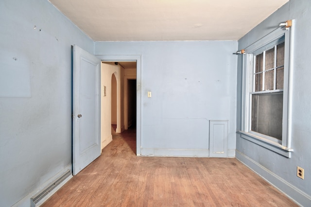 spare room featuring light hardwood / wood-style floors