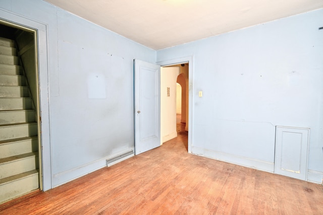 empty room with light hardwood / wood-style flooring