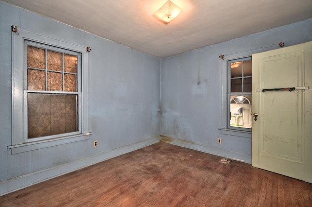 spare room featuring dark hardwood / wood-style floors