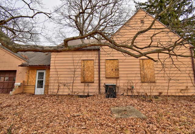 view of property exterior with a garage