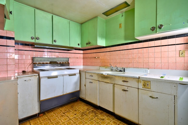 kitchen featuring extractor fan, sink, tile walls, and white range oven