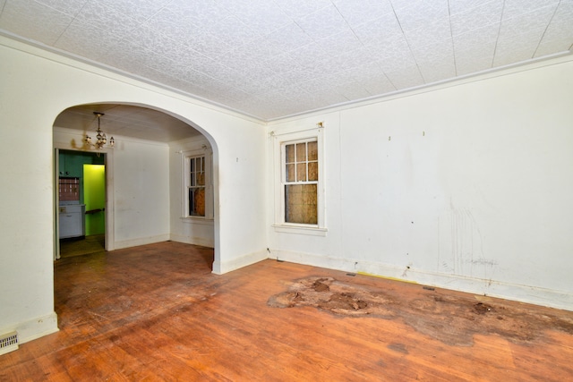 unfurnished room with dark hardwood / wood-style flooring