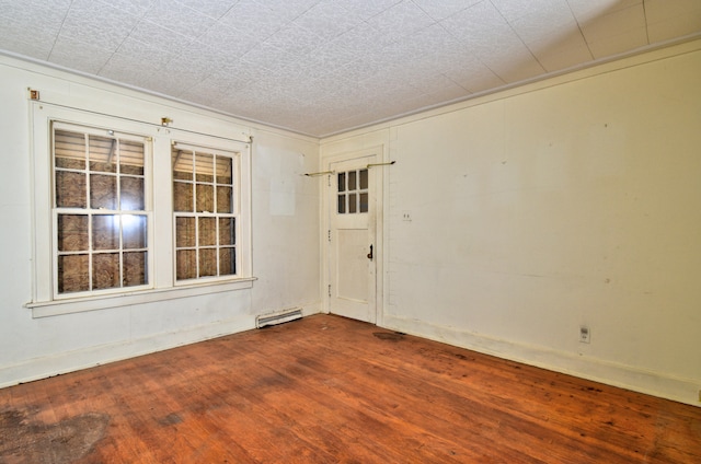 empty room with hardwood / wood-style flooring