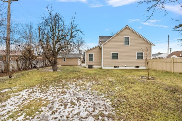 back of property featuring cooling unit and a yard