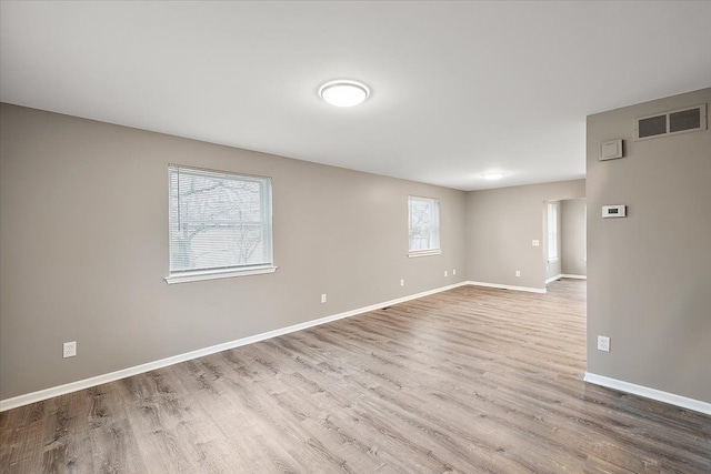 unfurnished room featuring light wood-type flooring