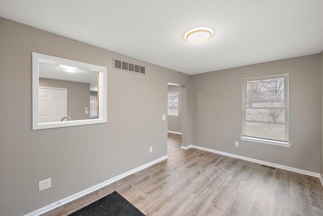 unfurnished room featuring light wood-type flooring