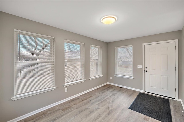 foyer with light hardwood / wood-style floors