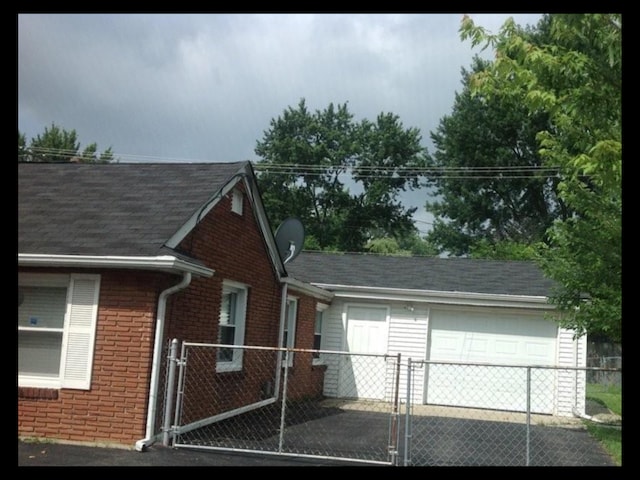 view of side of property with a garage