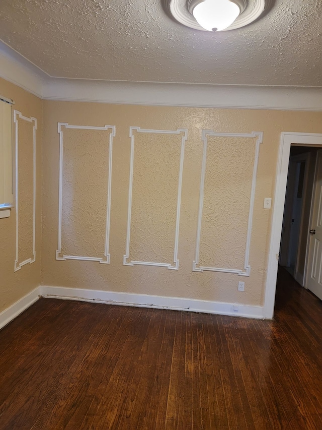 interior space featuring dark hardwood / wood-style flooring and a textured ceiling