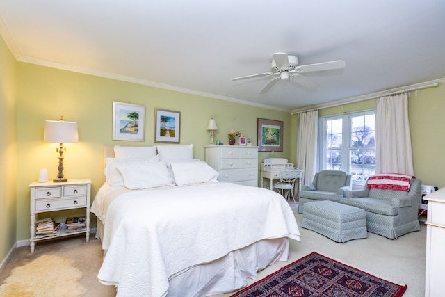 carpeted bedroom with crown molding and ceiling fan