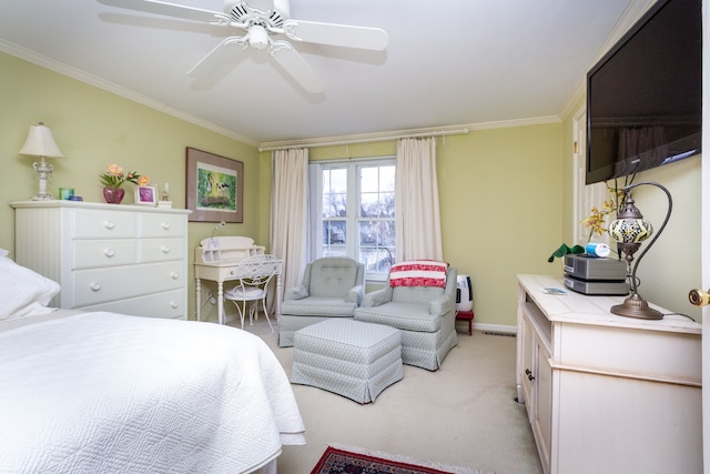 bedroom with light carpet, ornamental molding, and ceiling fan