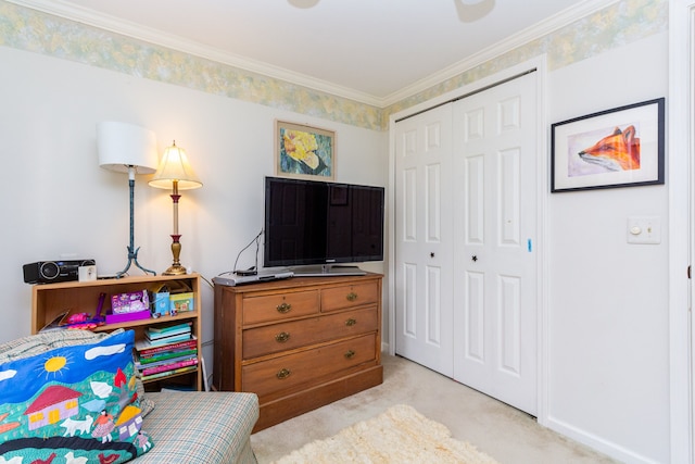 bedroom with ornamental molding, light colored carpet, and a closet