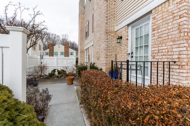 view of property exterior with a patio area