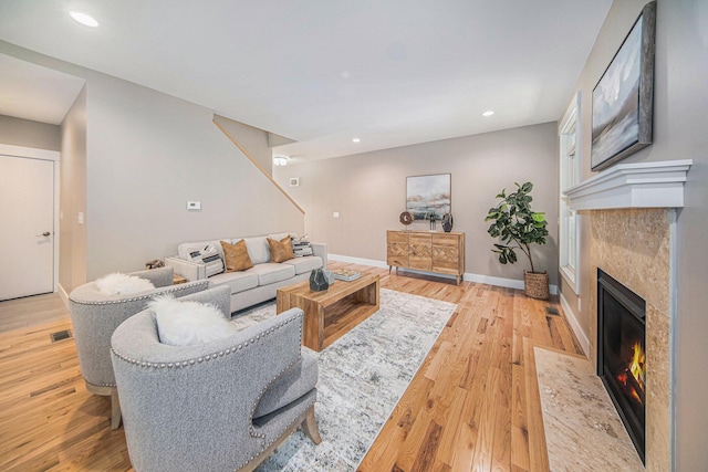 living room with light hardwood / wood-style flooring