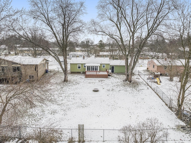 snowy yard featuring a wooden deck