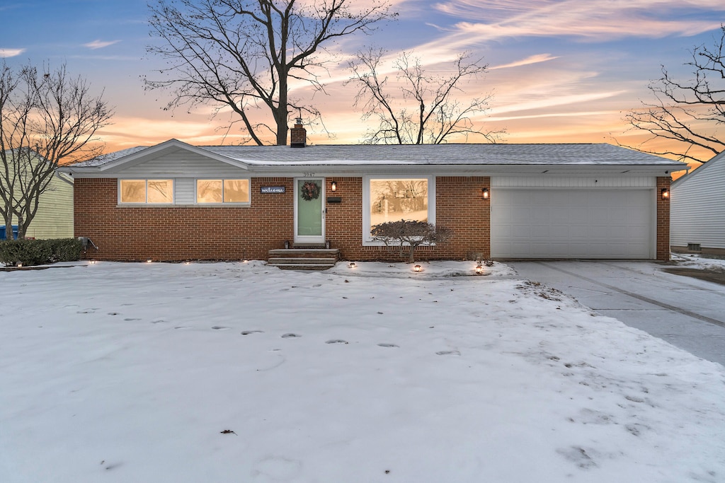 single story home featuring a garage