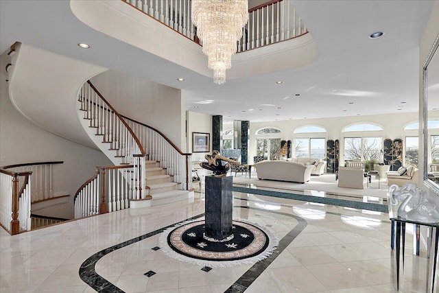 foyer featuring a high ceiling and a chandelier