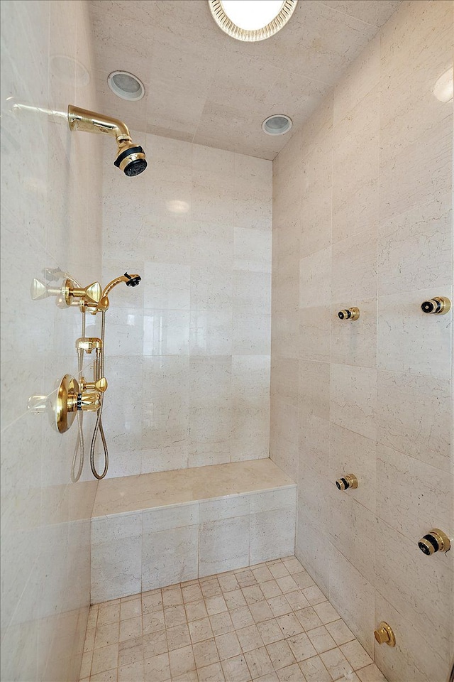 bathroom with a tile shower