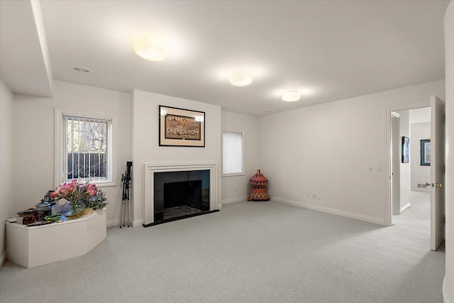 living room featuring carpet and plenty of natural light