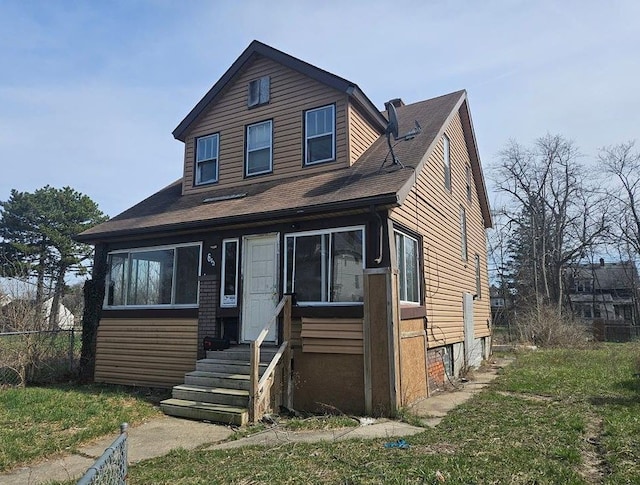 view of front of house featuring fence