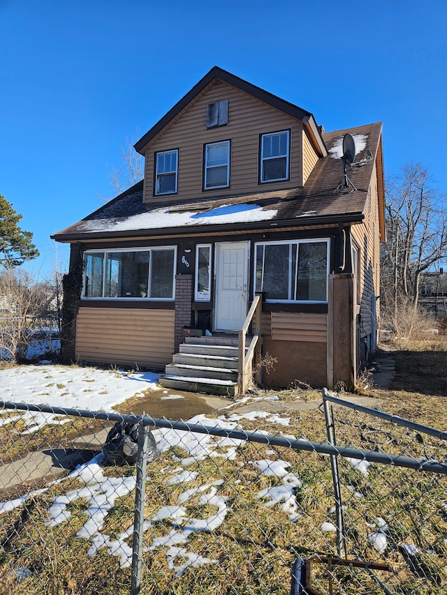 view of front of home featuring a fenced front yard and entry steps