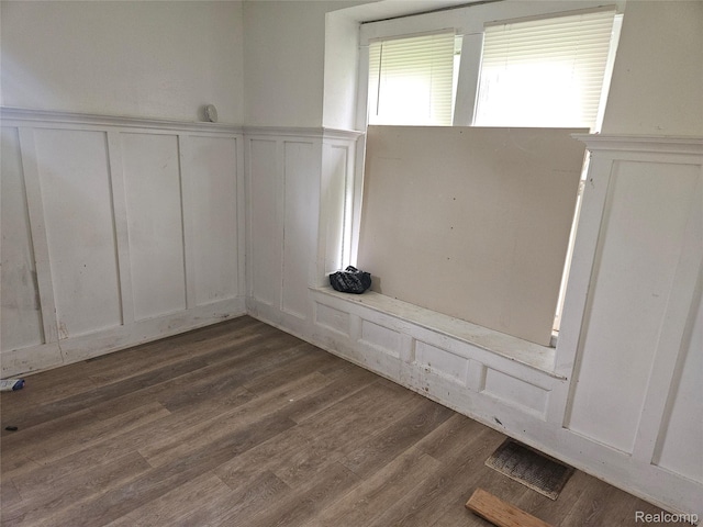 65 Portage St, Highland Park, MI 48203 - spare room featuring a decorative wall, wood finished floors, and a wainscoted wall