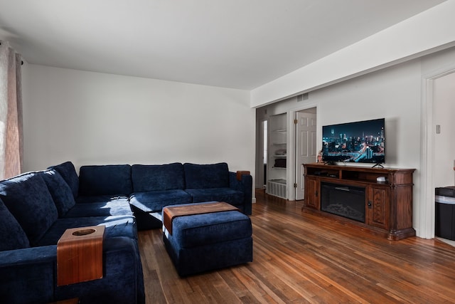 living room featuring dark hardwood / wood-style flooring